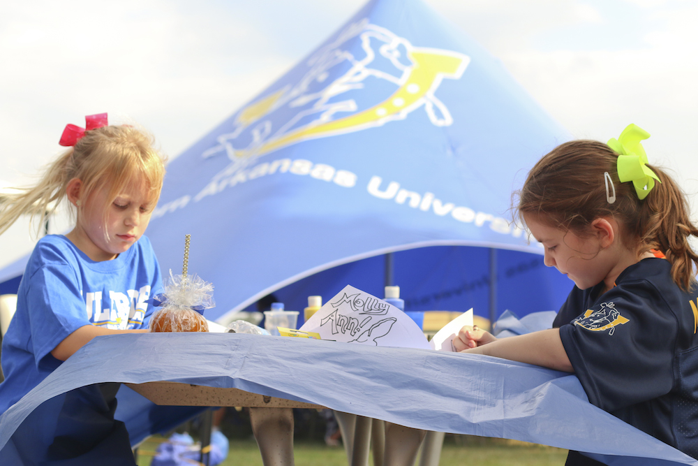 Future Muleriders enjoy face painting and coloring during an SAU Mulegating. Mulegating is sponsored by the SAU Alumni Association.