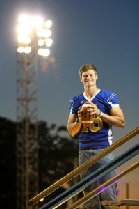 Mulerider Quarterback Tyler Sykora under the football field lights