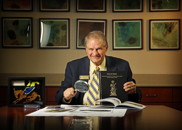 Claude Baker with book