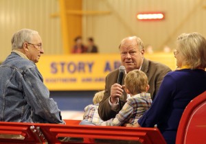 Therrel Story says a few words during the grand entry. He was joined in his horse-drawn wagon by his wife, Jan, and Bob and Molly Burns of Farmers Bank.